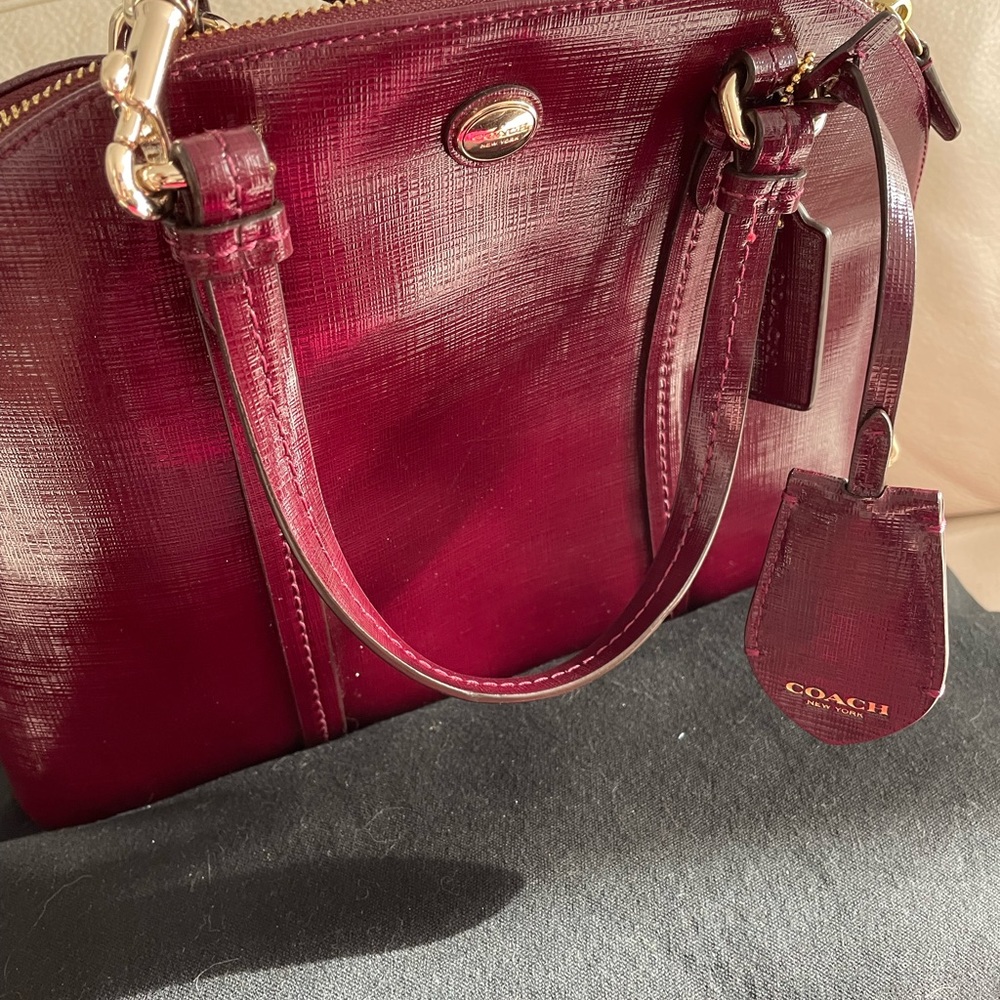 COACH satchel/crossbody of rich merlot smooth leather 13" x 10", 2-way top zip.